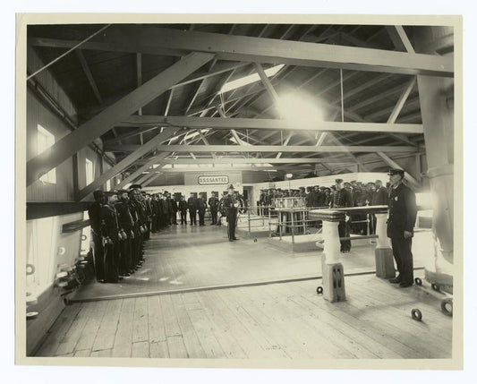 Reading the Articles of War on the deck of the old freight "Santee" of the Civil War period.