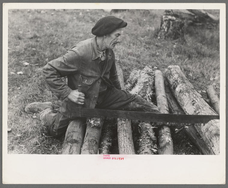 Farmer sawing wood near Bradford, Vermont
