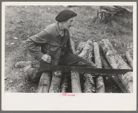 Farmer sawing wood near Bradford, Vermont